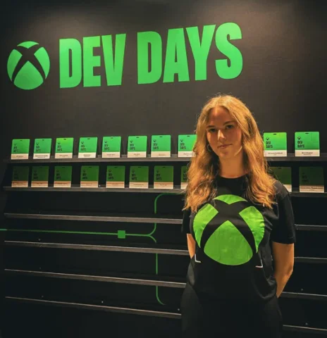 A person in front of a stand at Xbox Dev Days.
